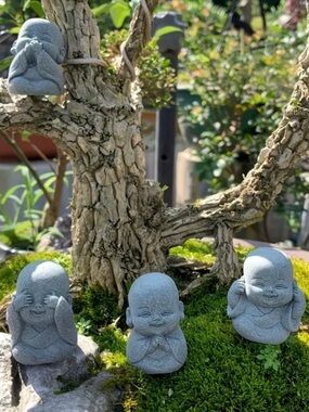 Set of Four Gray Buddha Figurines